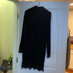 Joie mockneck with lace sleeves and hem in black